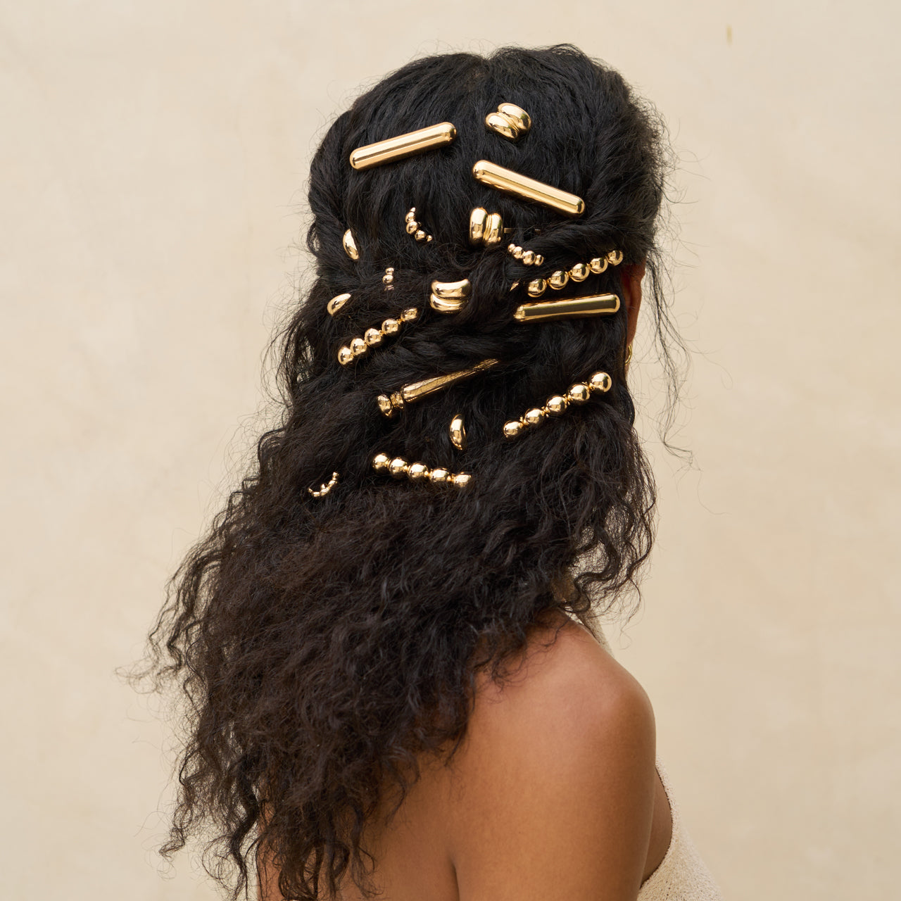 Spille per coda in metallo dorato