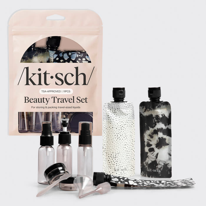 Kitsch Black & Ivory Travel Bottles 11pc Set laid out showing all pieces including bottles, jars, and spray