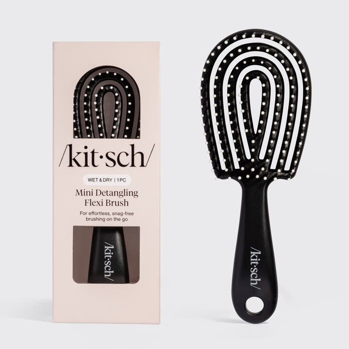 Black Kitsch Detangling Flexi Brush Mini on a soft neutral background