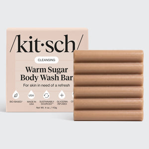 Kitsch Cleansing Warm Sugar Body Wash Bar with ridged bar and packaging on a light gray background