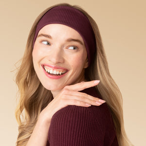 KITSCH Recycled Fabric Ribbed Elastic Headbands 2pc Set — lifestyle shot of a model wearing the Cherry Lacquer & Dusty Pink ribbed headband — comfortable stretch fit that holds hair back without pulling