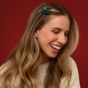 KITSCH Holiday Claw Clips 6pc Set - Mini — model with a green mini claw clip holding a half-up section at her crown — Brings a fun, festive finishing touch to every holiday look — holiday parties
