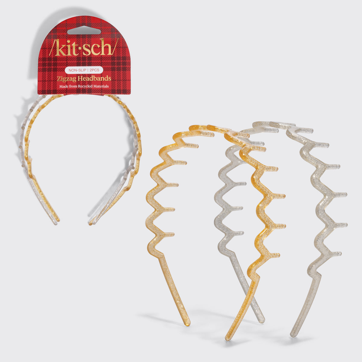 KITSCH Gold & Silver Zig Zag Headbands 2pc Set — gold and silver glitter zigzag headbands shown on and beside the red plaid Kitsch packaging card — Keeps hair comfortably away from the face — holiday outfits and everyday looks