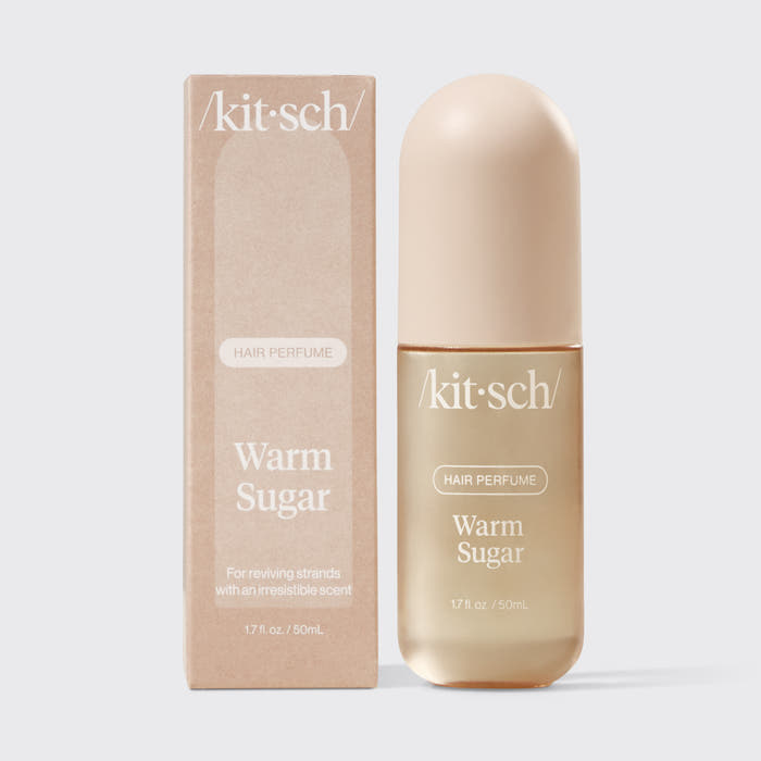 Kitsch Warm Sugar Hair & Body Perfume Mist bottle on a soft pink background