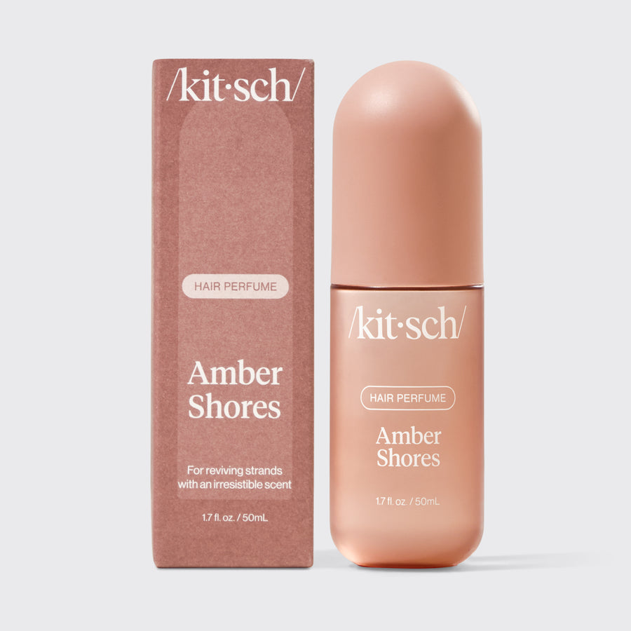 Kitsch Amber Shores Hair & Body Perfume Mist bottle on a soft warm background