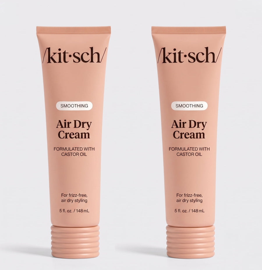 Two tubes of Kitsch Smoothing Air Dry Cream formulated with castor oil, 5 fl. oz. (148 mL), displayed side by side on a white background for frizz-free, air-dry styling.